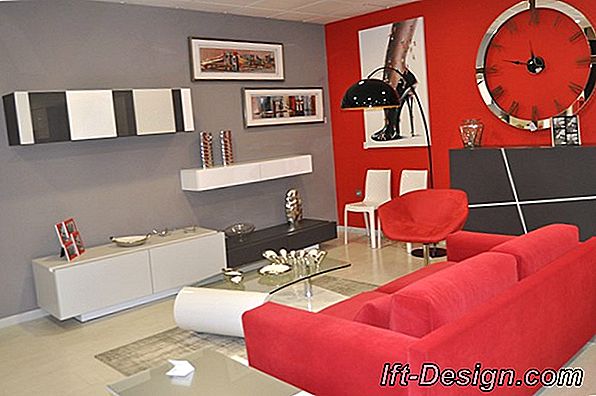 Decora una sala de estar en rojo y blanco con muebles lacados.